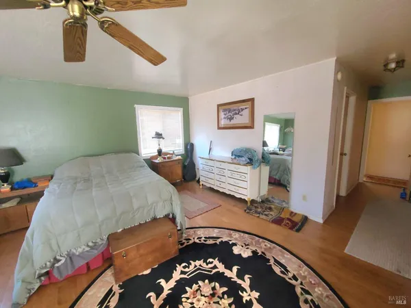 a bedroom with bed and window