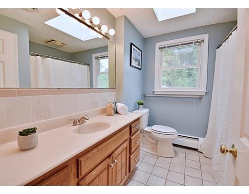 14 Bear Hill Road Billerica, MA 01821 - Photo 13 of 25 a bathroom with a sink a toilet and mirror