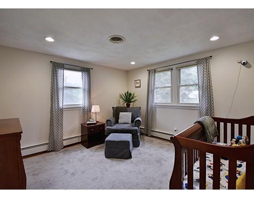 14 Bear Hill Road Billerica, MA 01821 - Photo 18 of 25 a living room with furniture stairs and a window