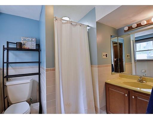 14 Bear Hill Road Billerica, MA 01821 - Photo 23 of 25 a bathroom with a sink a toilet and shower
