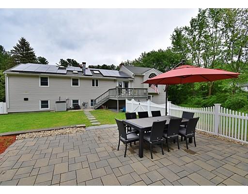 14 Bear Hill Road Billerica, MA 01821 - Photo 4 of 25 a view of a house with backyard sitting area and garden