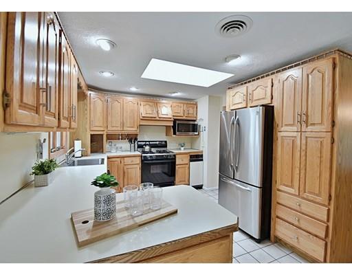 14 Bear Hill Road Billerica, MA 01821 - Photo 9 of 25 a kitchen with stainless steel appliances granite countertop a refrigerator a stove a sink and a refrigerator