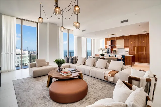 a bedroom with furniture and large windows