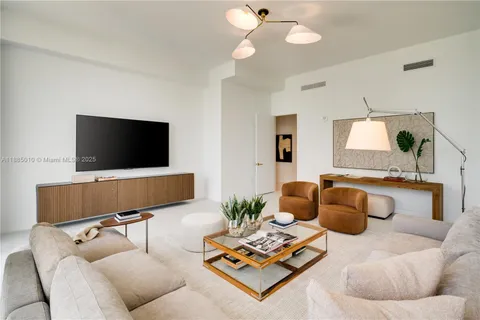 a bedroom with bed and a large window