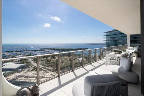 a view of balcony with furniture