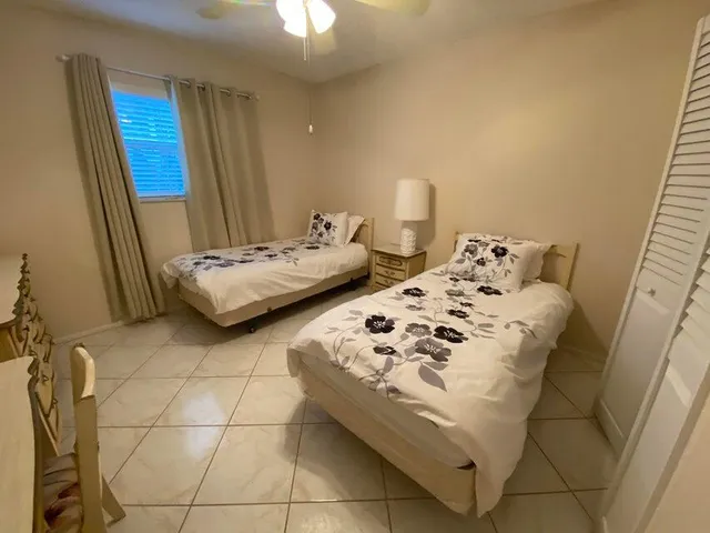 a bedroom with a bed and a mirror