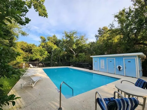 a view of a swimming pool with a patio