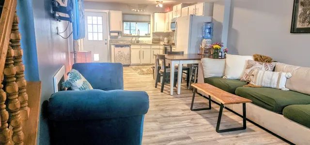 a living room with furniture and a table