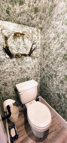 a bathroom with a toilet and a sink