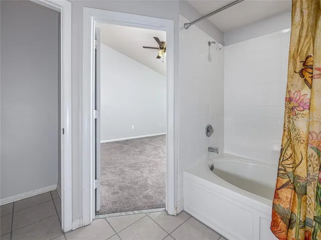 a bathroom with a bathtub and shower