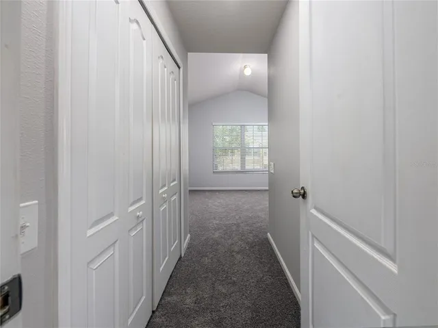 a view of a hallway with a white walls