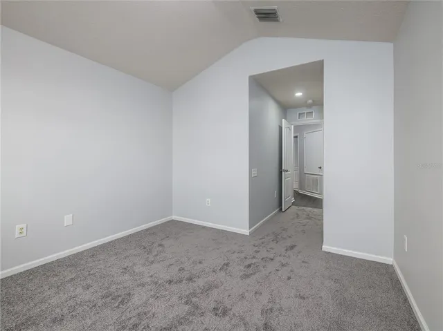an empty room with a bathroom