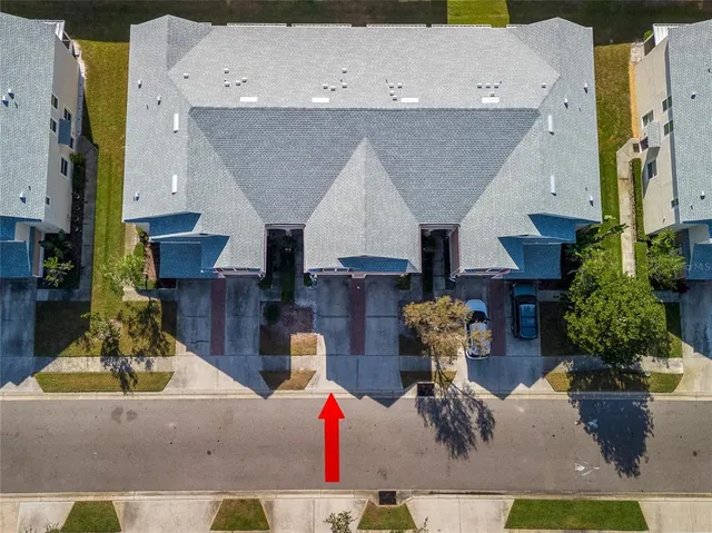 an aerial view of a house with entertaining space