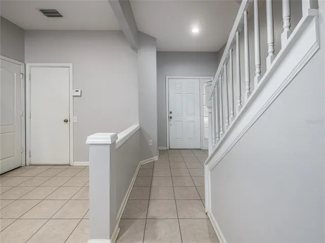 a view of a hallway with washer and dryer