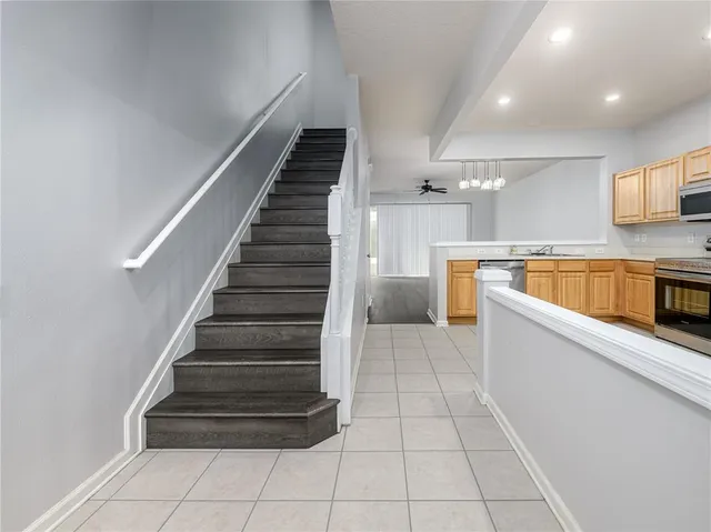 a view of kitchen with sink microwave and stove