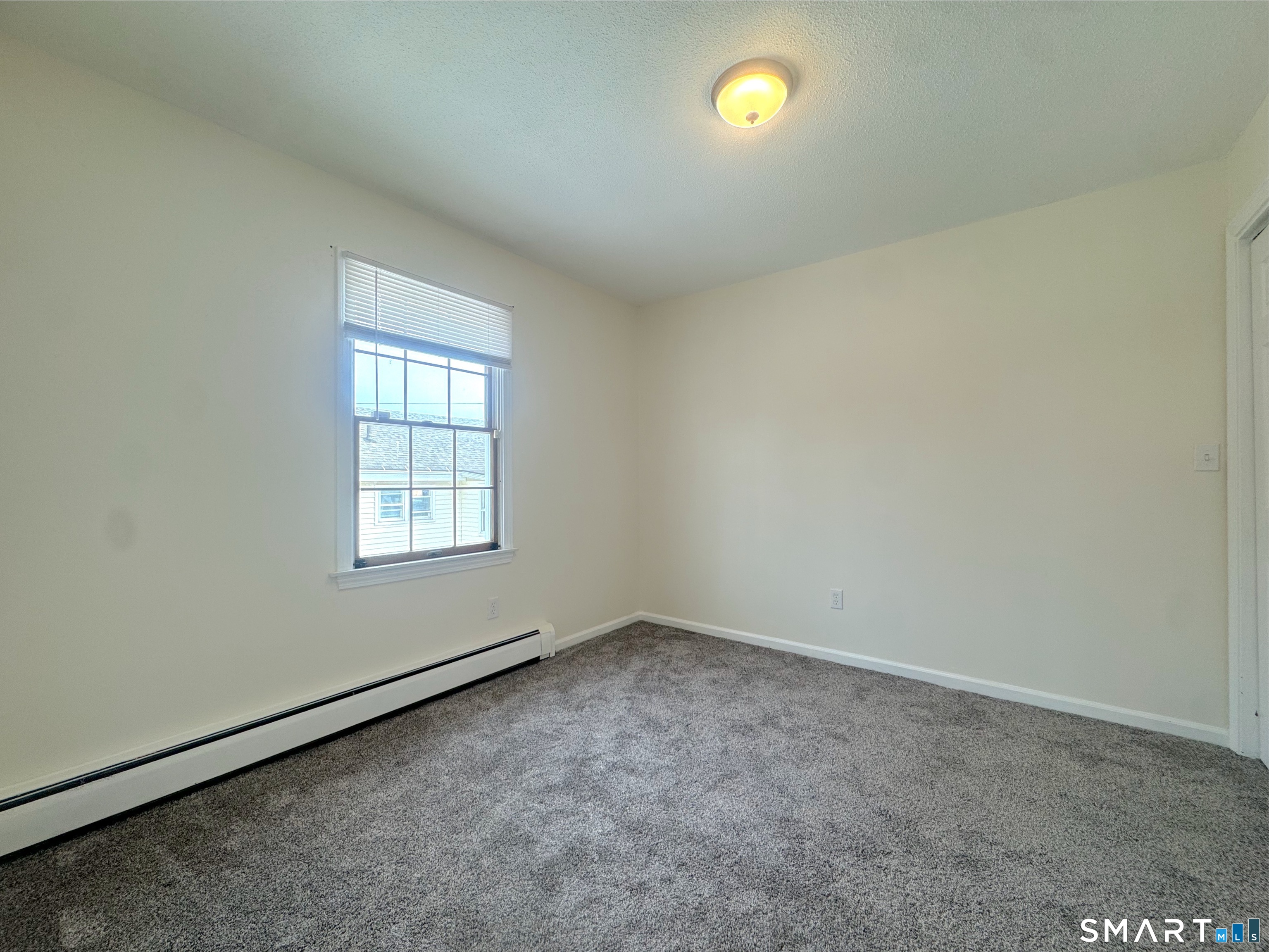666 Broad Street, Unit 7 Meriden, CT 06450 - Photo 11 of 12 an empty room with a window