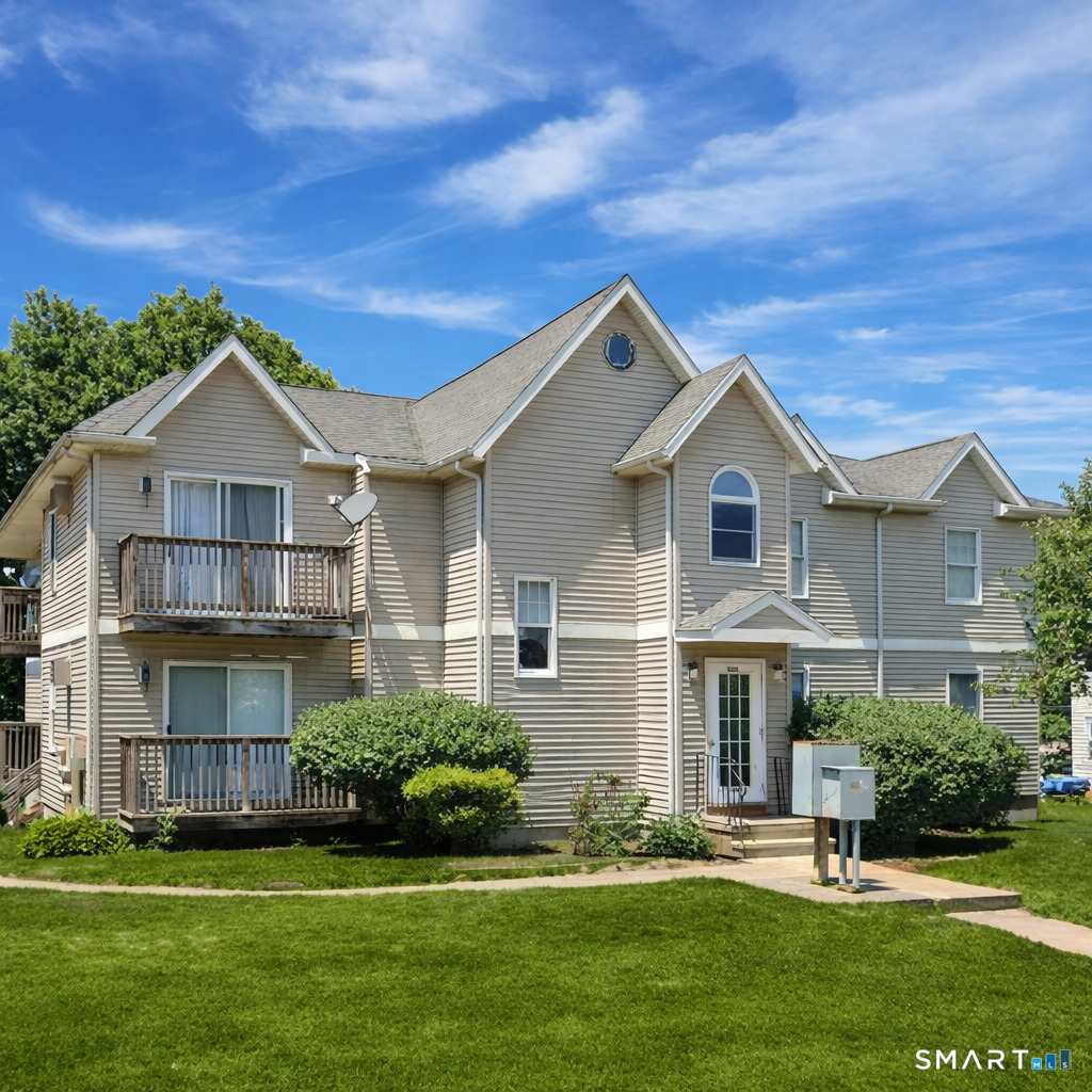 666 Broad Street, Unit 7 Meriden, CT 06450 - Photo 12 of 12 a front view of a house with a yard