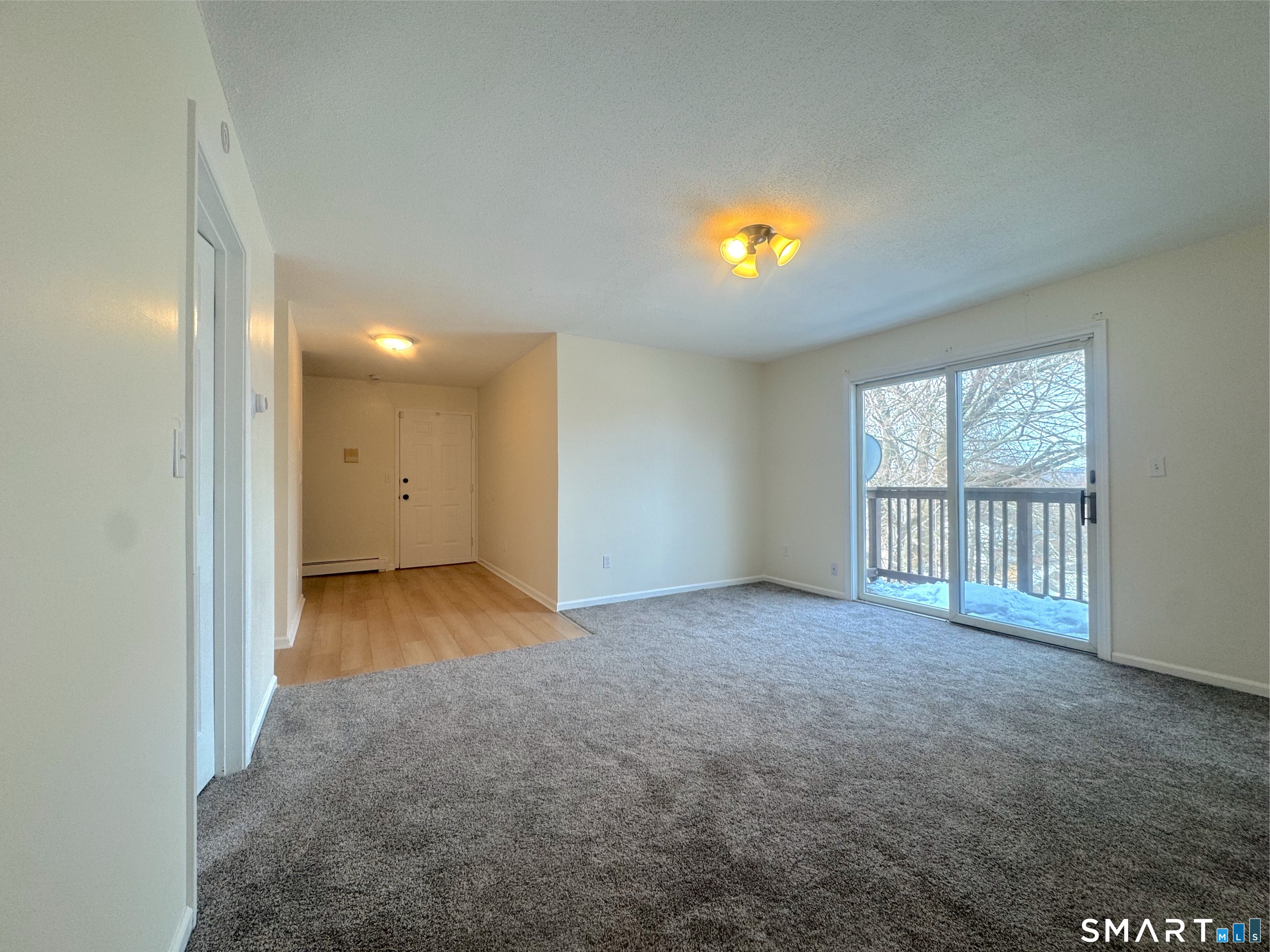 666 Broad Street, Unit 7 Meriden, CT 06450 - Photo 10 of 12 a view of an empty room with a window