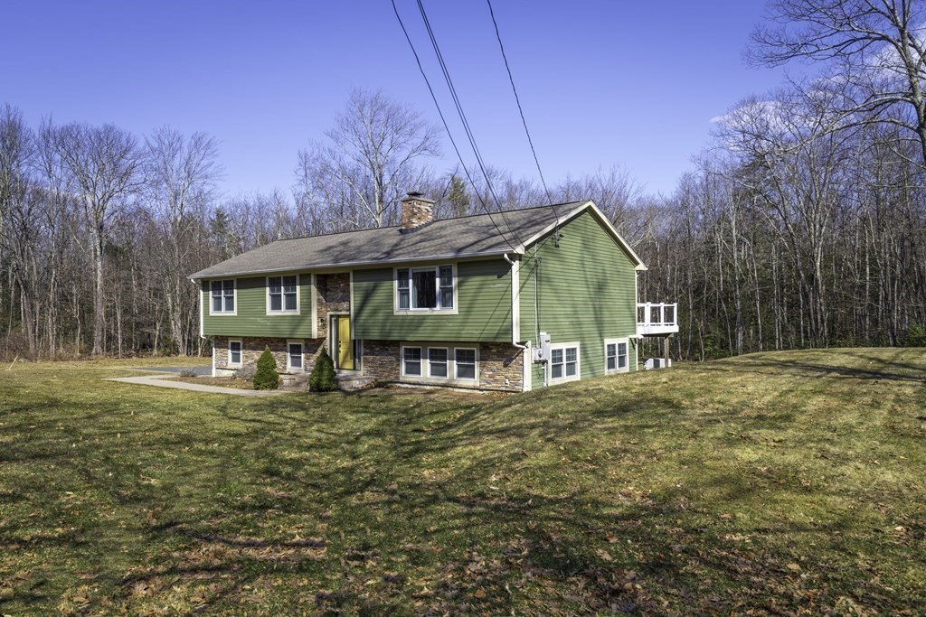 124 Southampton Road Westhampton, MA 01027 - Photo 1 of 25 a view of a house with a yard patio and deck