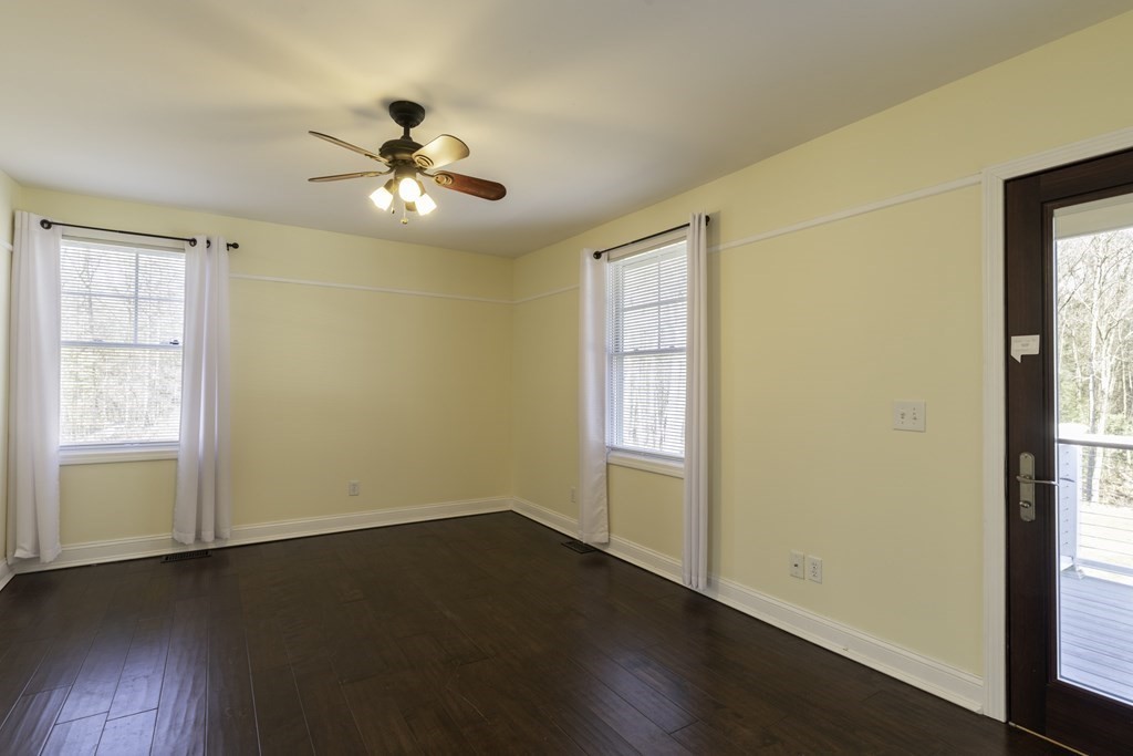 124 Southampton Road Westhampton, MA 01027 - Photo 12 of 25 a view of an empty room with wooden floor and a window
