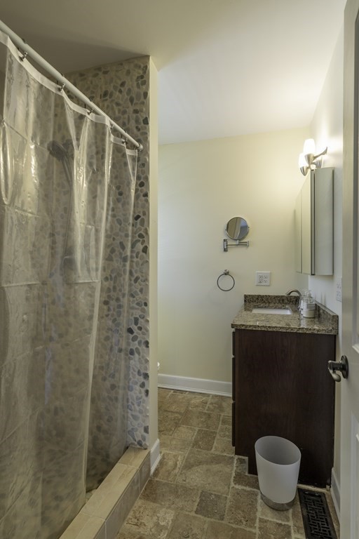 124 Southampton Road Westhampton, MA 01027 - Photo 14 of 25 a bathroom with a granite countertop sink a toilet and a shower