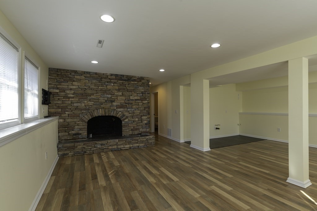 124 Southampton Road Westhampton, MA 01027 - Photo 20 of 25 a view of an empty room with a fireplace and a window