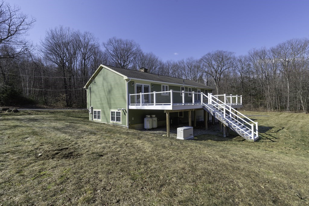 124 Southampton Road Westhampton, MA 01027 - Photo 4 of 25 a view of a house with a yard and sitting area