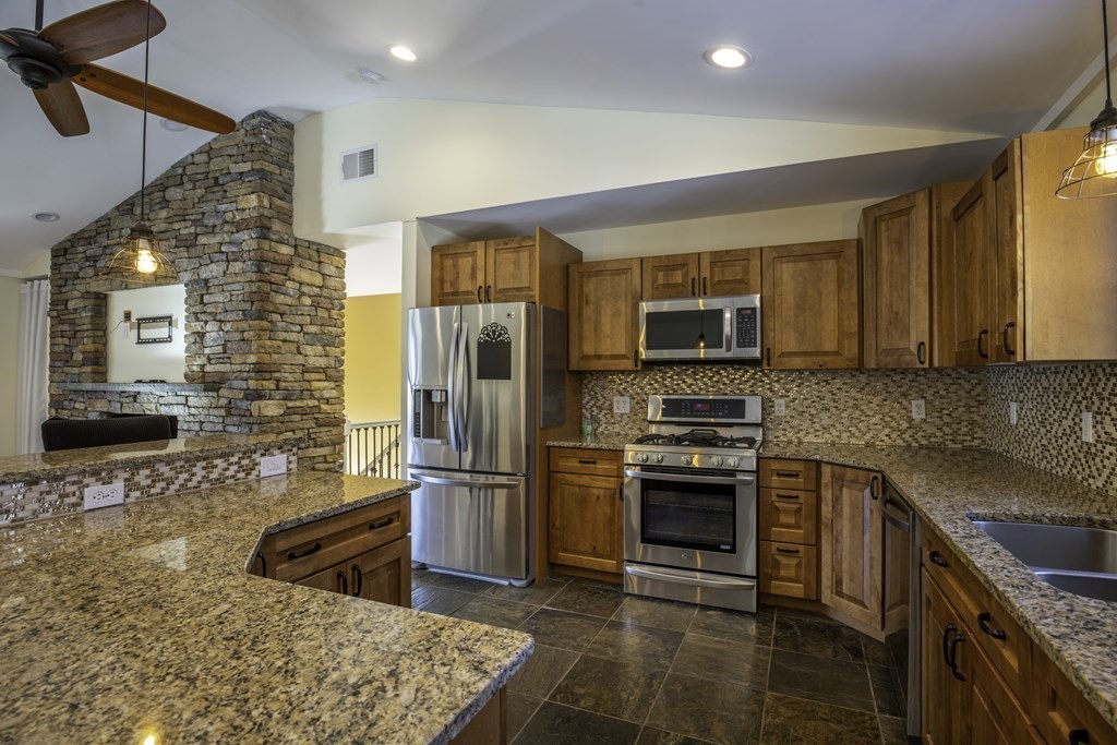 124 Southampton Road Westhampton, MA 01027 - Photo 5 of 25 a kitchen with stainless steel appliances granite countertop a refrigerator stove and oven