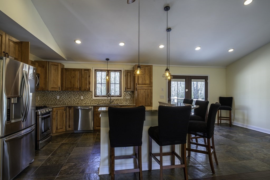 124 Southampton Road Westhampton, MA 01027 - Photo 7 of 25 a large kitchen with a table and chairs