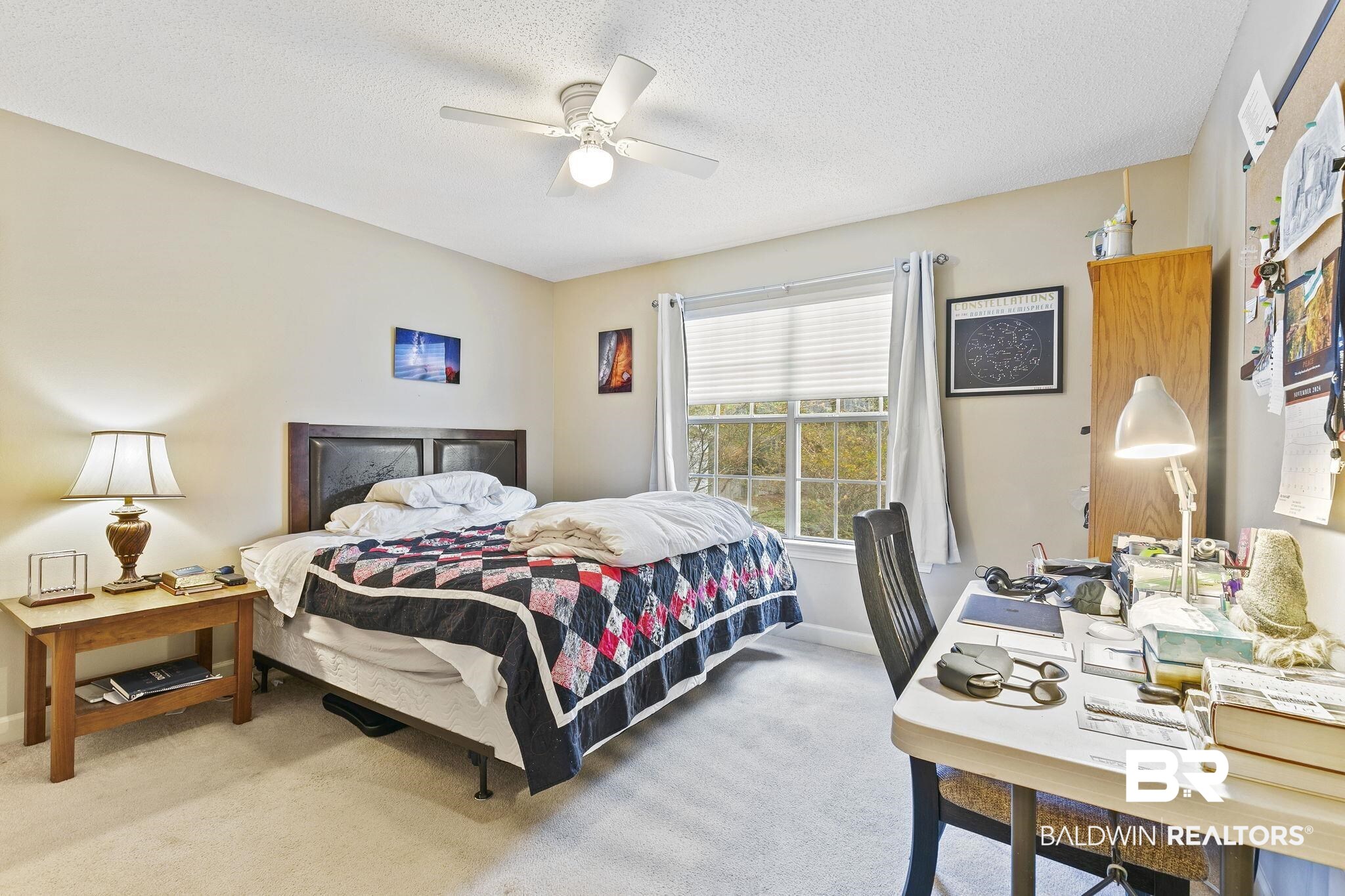 22 Pirates Lane Daphne, AL 36527 - Photo 30 of 36 Bedroom featuring ceiling fan, light colored carpet, and a textured ceiling