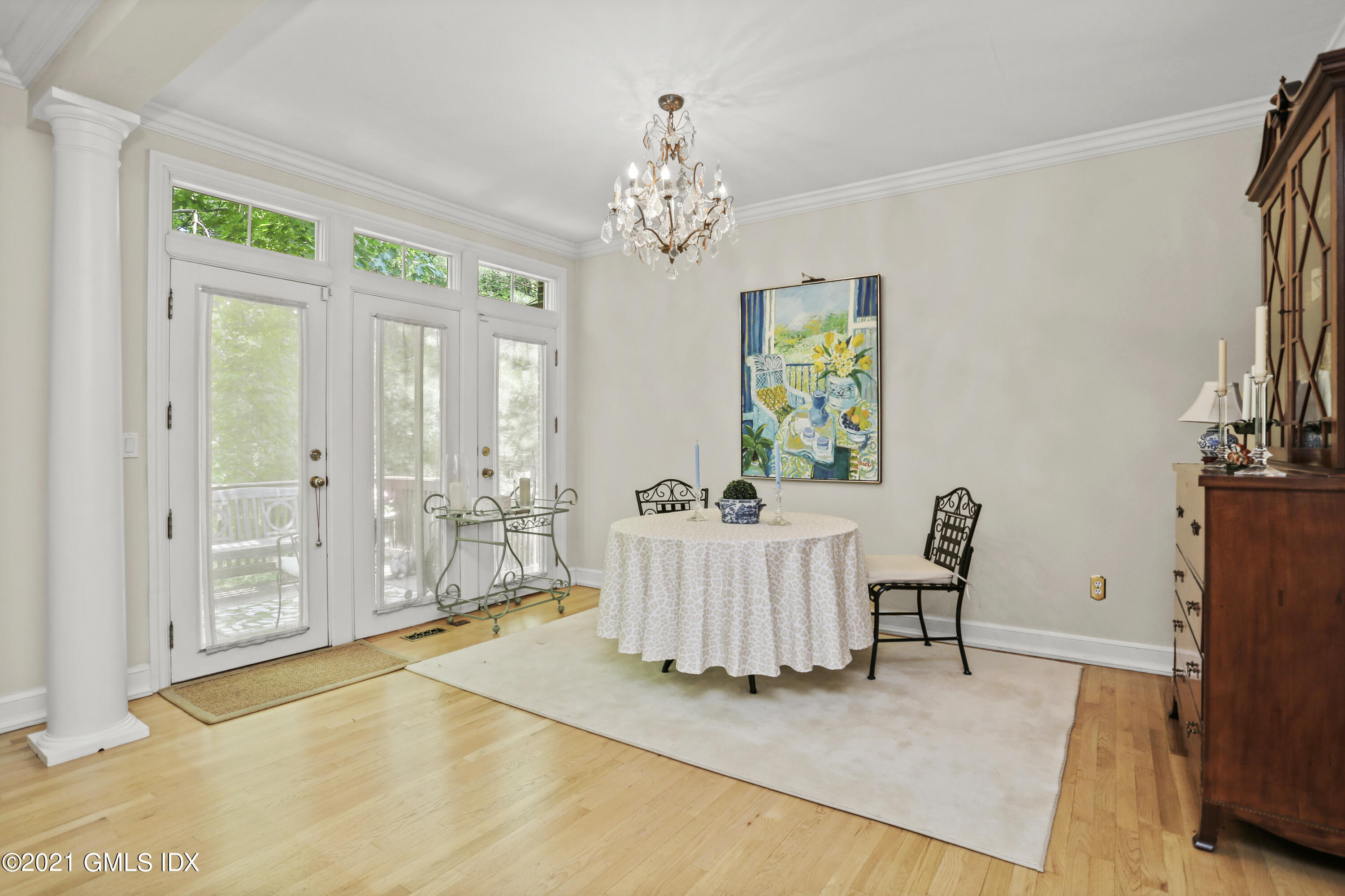 73 Weaver Street, Unit 4 Greenwich, CT 06831 - Photo 14 of 35 a living room with furniture and a chandelier