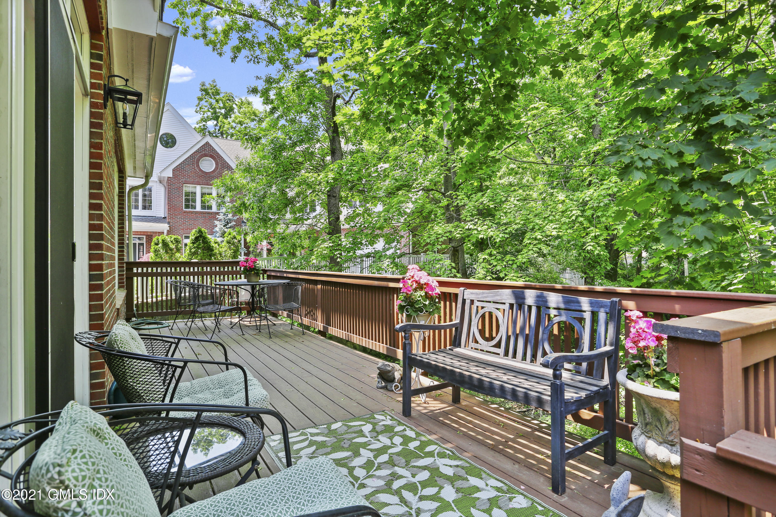 73 Weaver Street, Unit 4 Greenwich, CT 06831 - Photo 3 of 35 a view of a chairs and table on the balcony