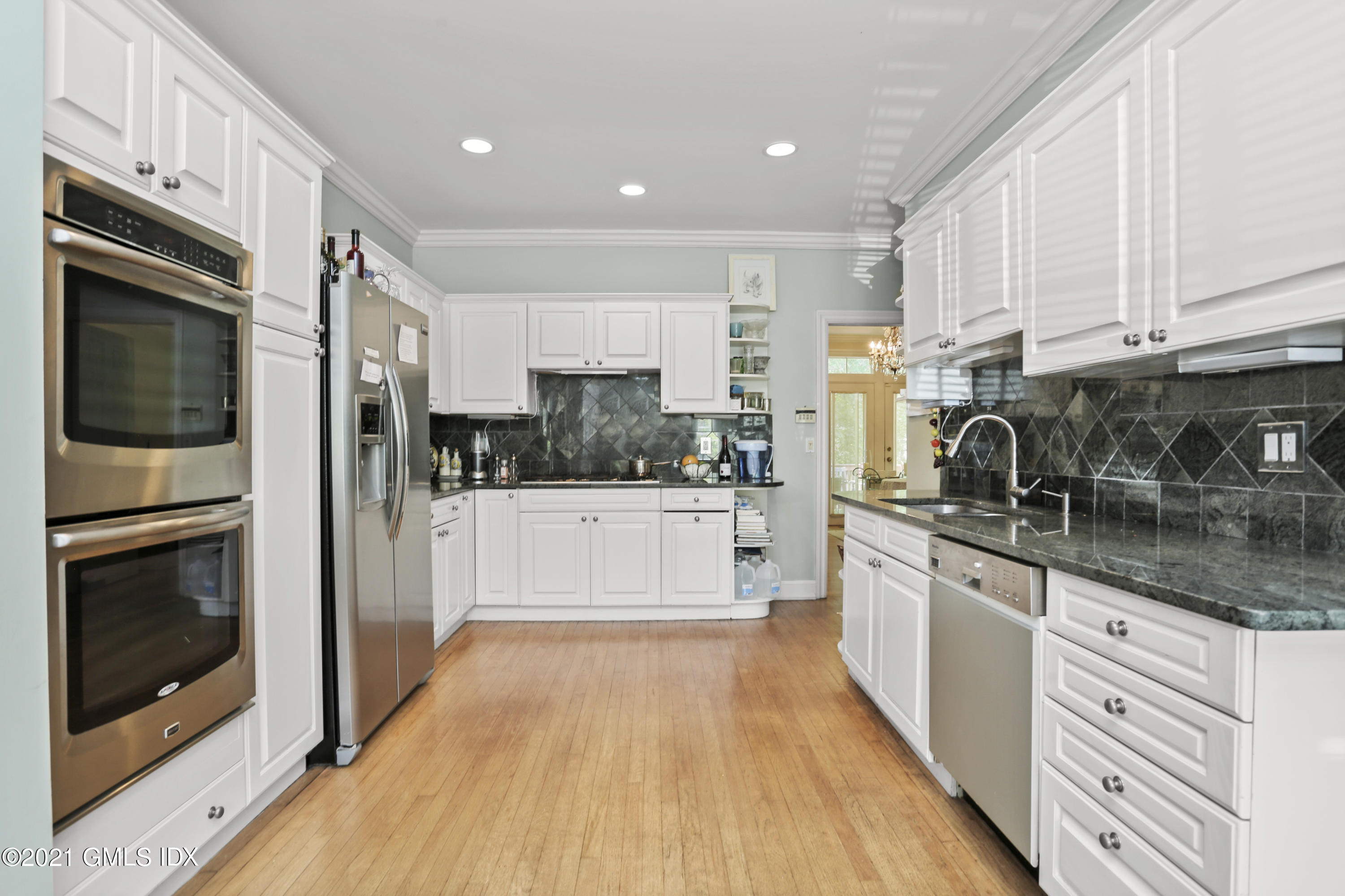 73 Weaver Street, Unit 4 Greenwich, CT 06831 - Photo 5 of 35 a large kitchen with stainless steel appliances granite countertop a stove a sink and a refrigerator