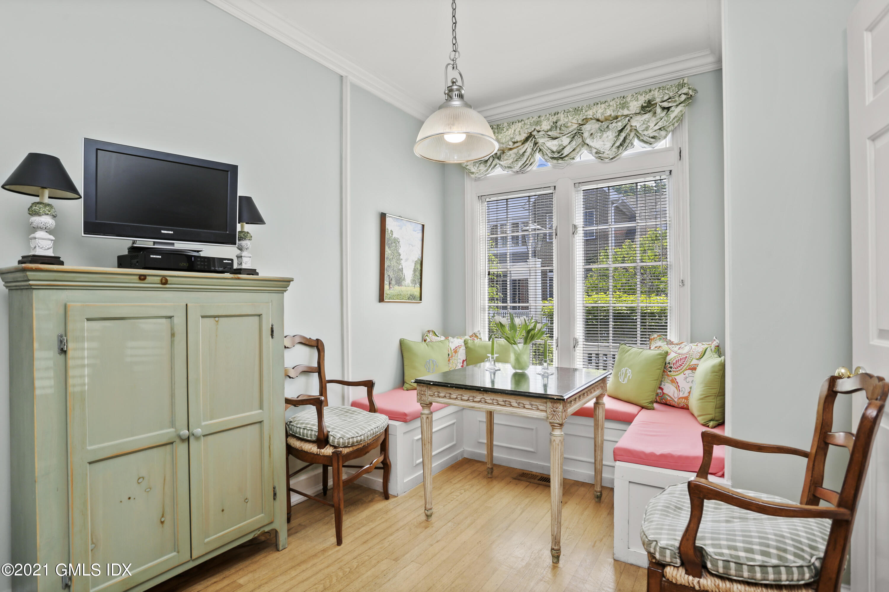 73 Weaver Street, Unit 4 Greenwich, CT 06831 - Photo 8 of 35 a living room with furniture a flat screen tv and windows