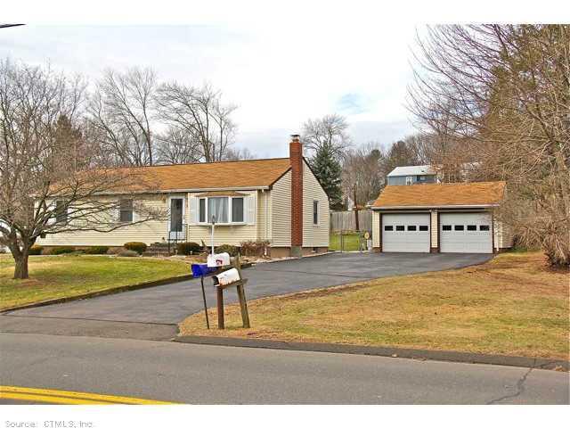 101 Washington Road Cromwell, CT 06416 - Photo 1 of 1 a front view of house with yard and trees