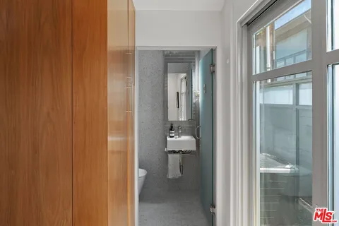 a bathroom with a glass door shower