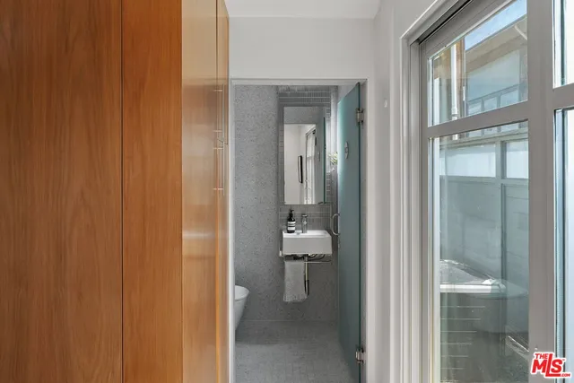 a bathroom with a glass door shower