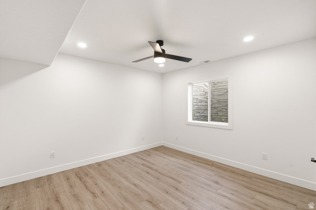 870 North Ada Loop Lehi, UT 84048 - Photo 42 of 51 Room featuring wood-finish flooring, white walls, and a modern ceiling fan with integrated lighting