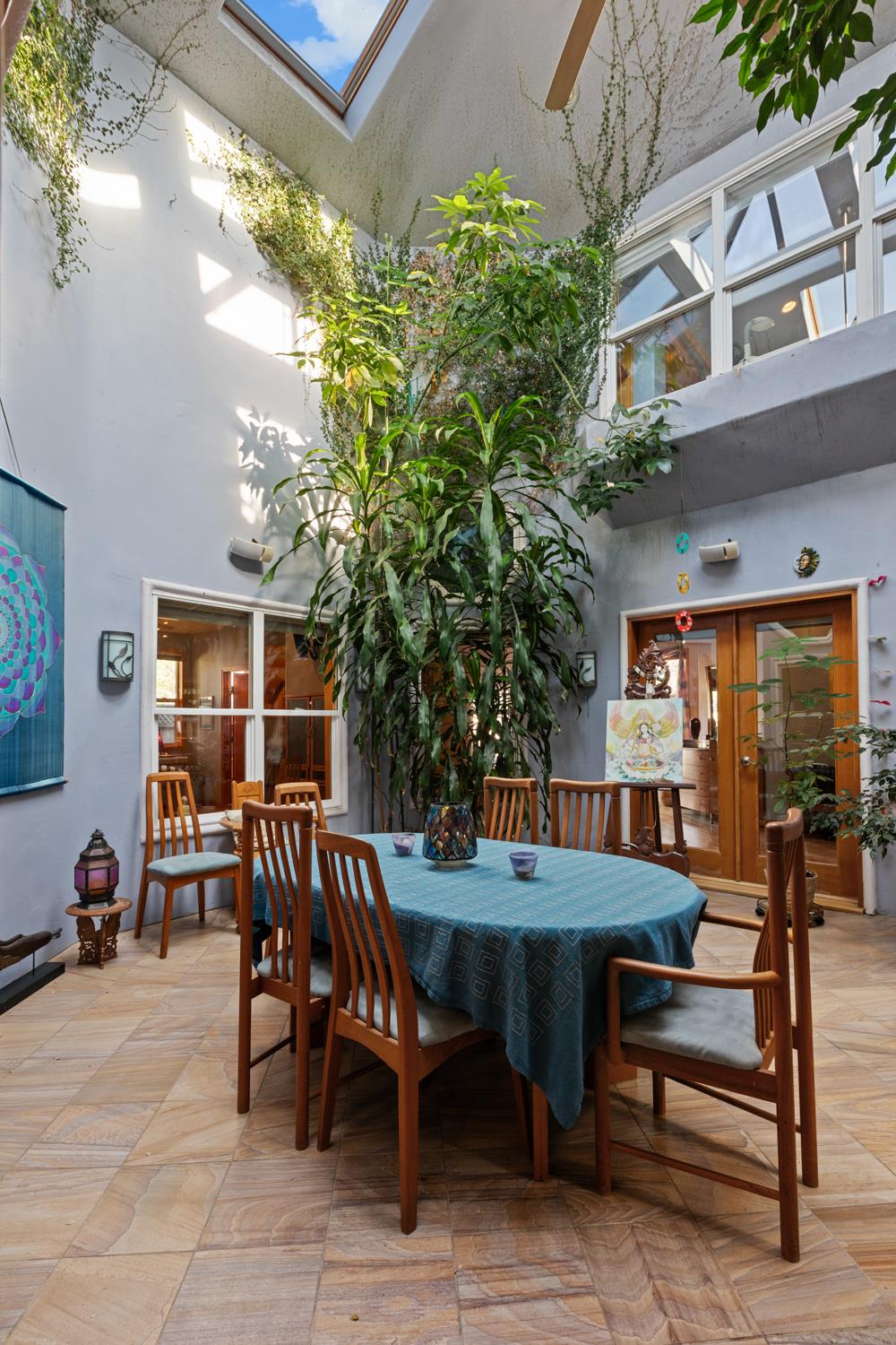 4838 Robertson Avenue Carmichael, CA 95608 - Photo 13 of 52 a view of a patio with table and chairs and potted plants
