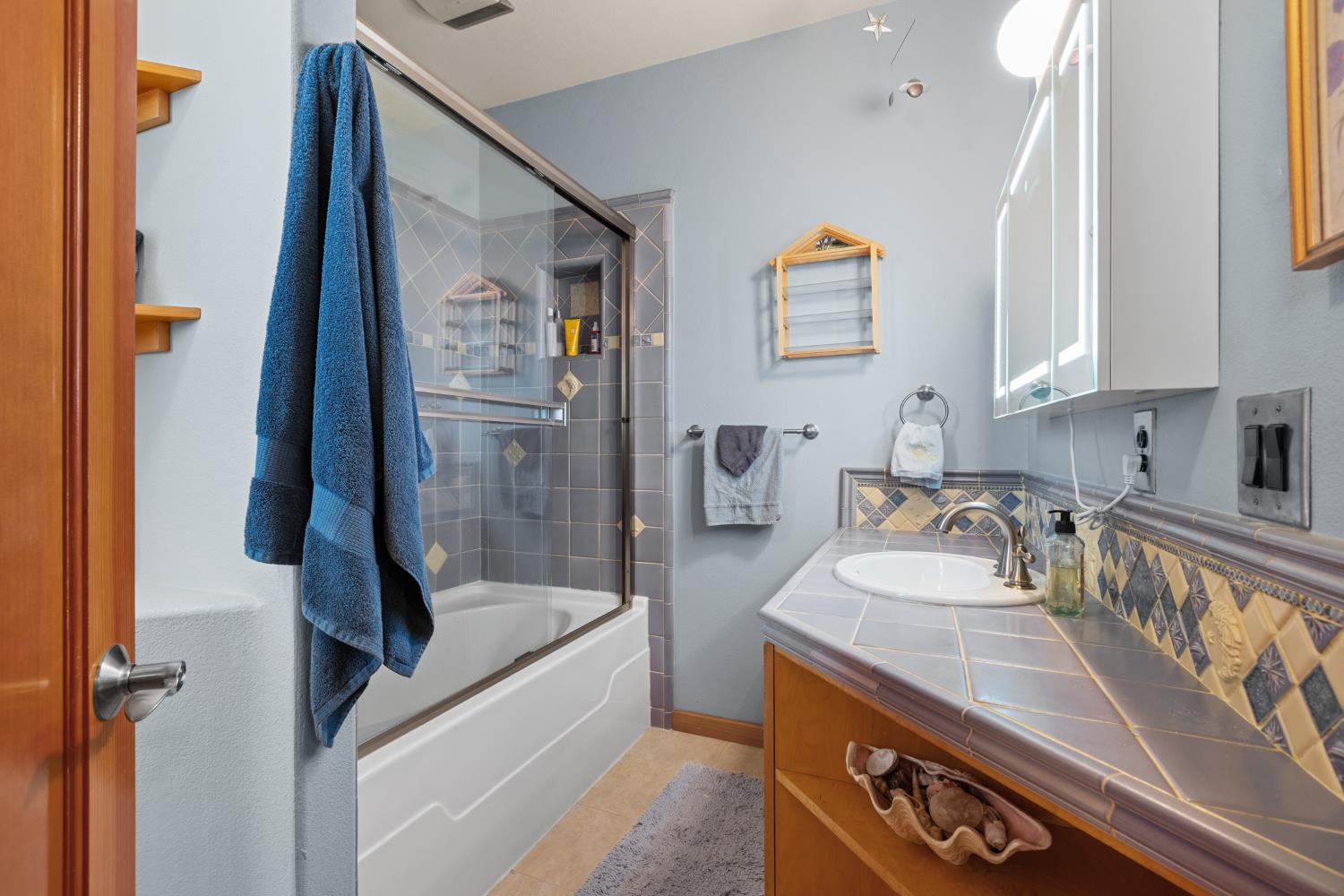 4838 Robertson Avenue Carmichael, CA 95608 - Photo 26 of 52 a bathroom with a tub sink and mirror