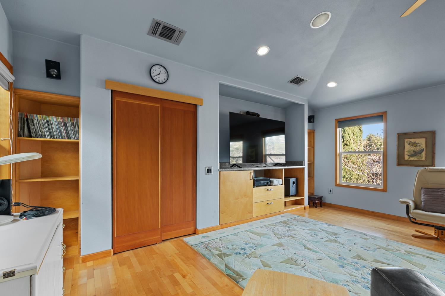 4838 Robertson Avenue Carmichael, CA 95608 - Photo 34 of 52 a view of a livingroom with a flat screen tv wooden floor and a window