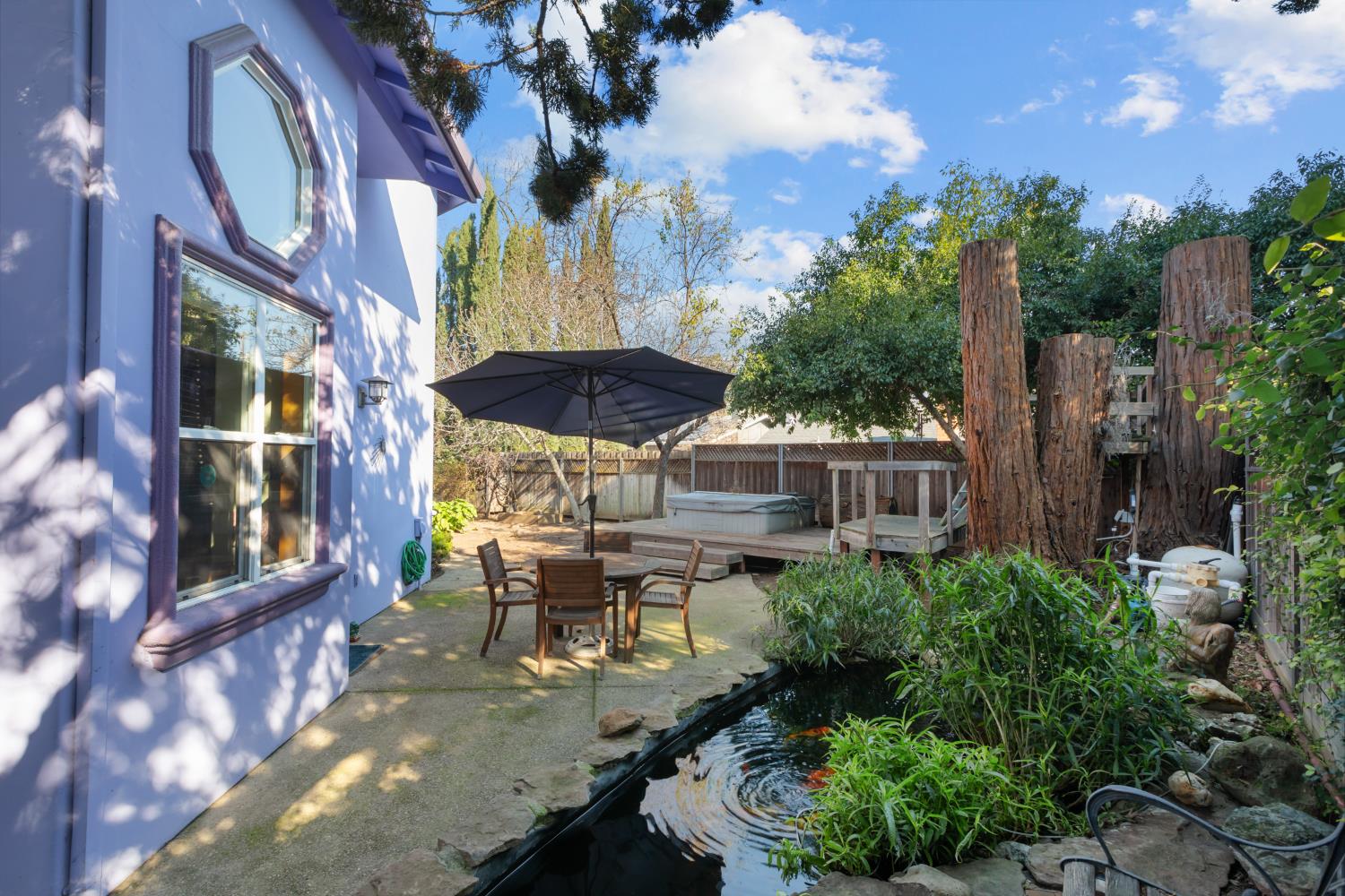 4838 Robertson Avenue Carmichael, CA 95608 - Photo 43 of 52 a view of a patio with table and chairs and potted plants