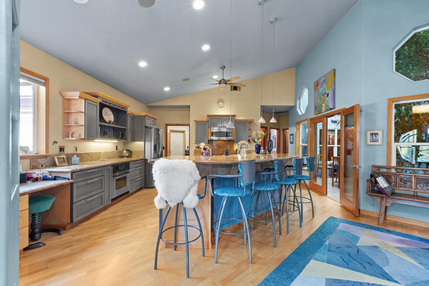 4838 Robertson Avenue Carmichael, CA 95608 - Photo 6 of 52 a living room with stainless steel appliances kitchen island granite countertop furniture wooden floor and a kitchen view