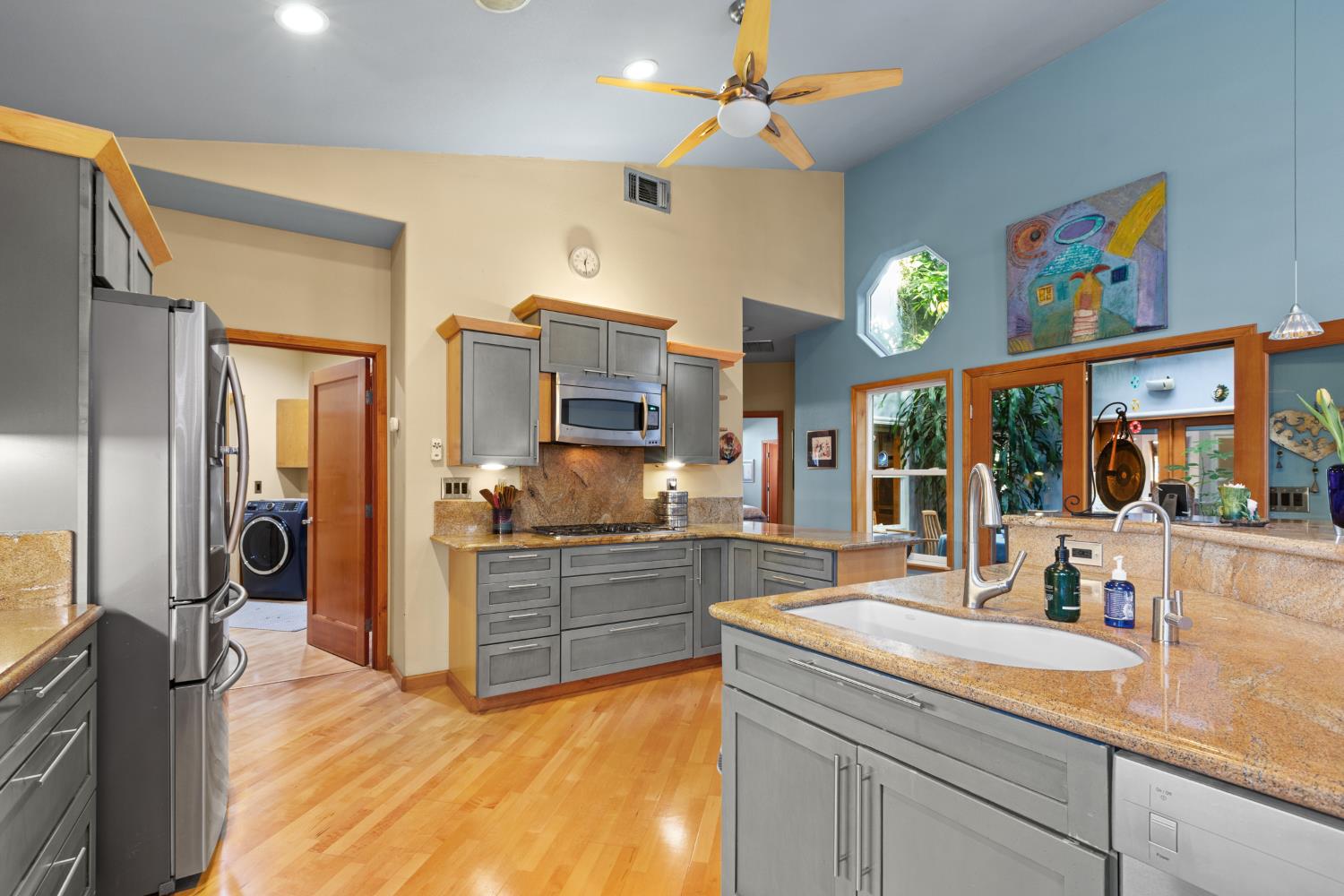 4838 Robertson Avenue Carmichael, CA 95608 - Photo 9 of 52 a kitchen with stainless steel appliances granite countertop a sink and a refrigerator