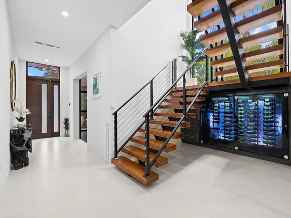 a large kitchen with stainless steel appliances a stove oven and a kitchen island