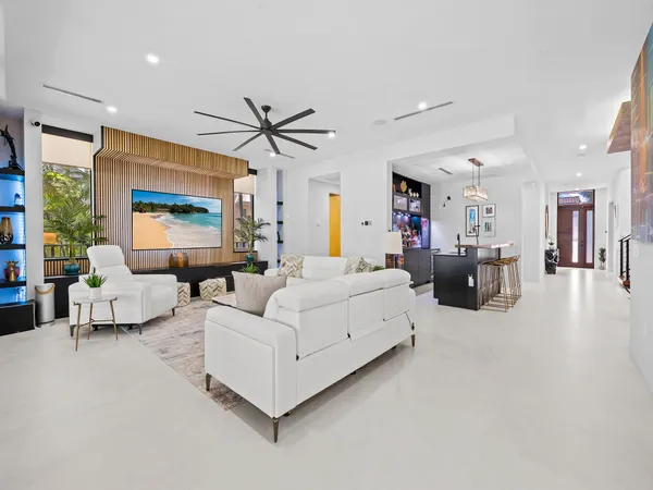 a kitchen with stainless steel appliances a stove a sink and cabinets
