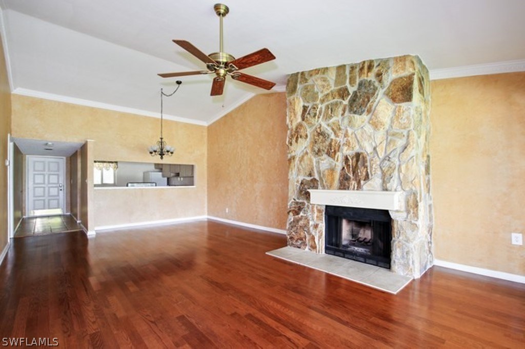 16740 Partridge Place Road, Unit 204 Fort Myers, FL 33908 - Photo 16 of 25 a view of empty room with wooden floor and fireplace