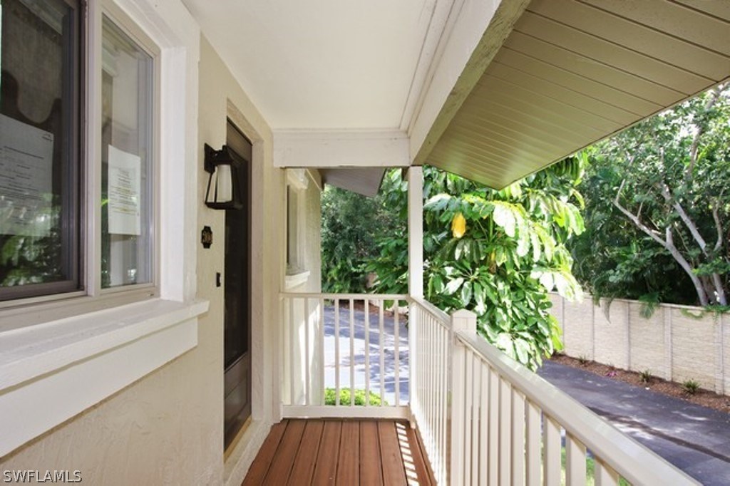 16740 Partridge Place Road, Unit 204 Fort Myers, FL 33908 - Photo 8 of 25 a view of a balcony with wooden floor