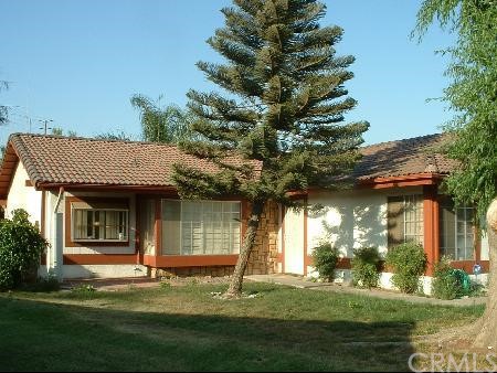 6615 Solano Drive Riverside, CA 92509 - Photo 1 of 1 a view of a house with a yard