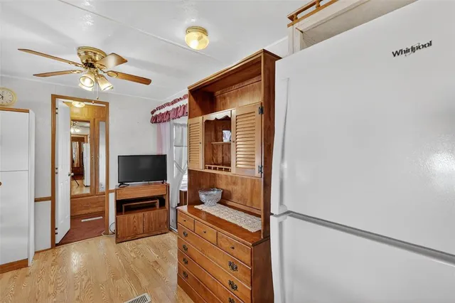 a view of a livingroom with wooden floor